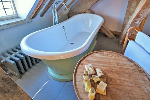 Unwind in the roll top bathtub after a day spent exploring