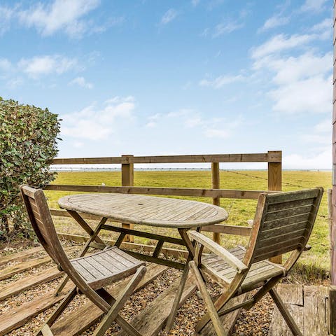 Enjoy morning coffees in the sun while gazing out towards the sea