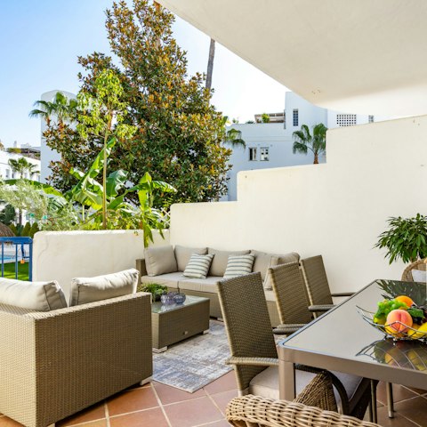 Dine alfresco on your terrace dappled with greenery