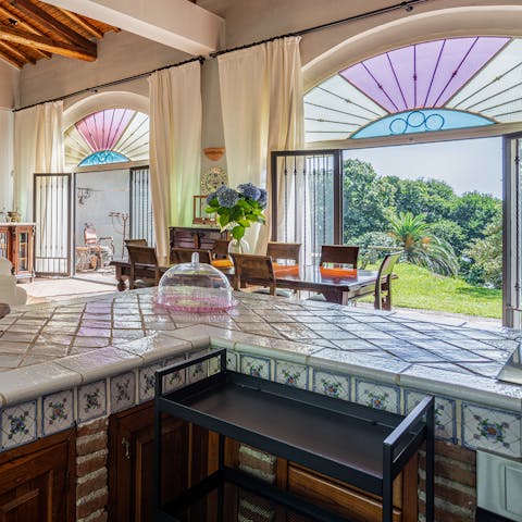 Admire the art deco windows from the traditional Sicilian kitchen