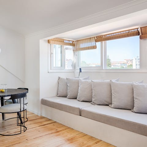 Get cosy in the comfy window nook and enjoy the views of the city