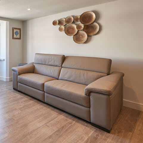 Stretch out in the living area after a day of soaking up Scarborough