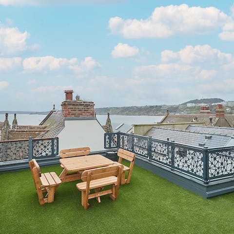 Dine alfresco on the rooftop overlooking the beach