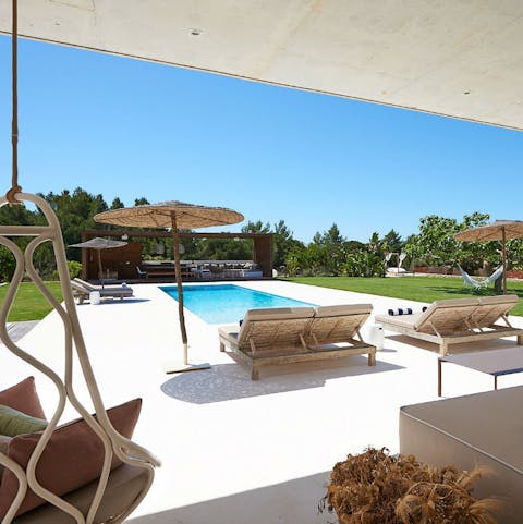 Relax in one of several chill out areas surrounding the pristine pool