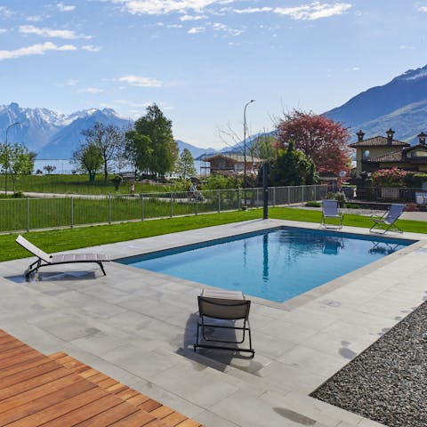 Admire the lake and mountain views from the private pool