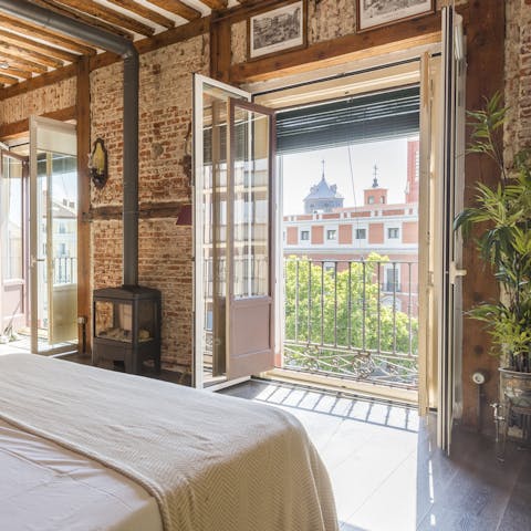 Wake up to beautiful views of Plaza de Jacinto Benavente from your home's Juliet balconies