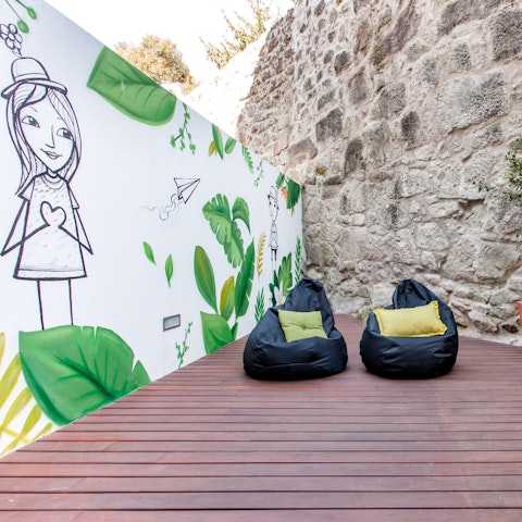 Head out onto the apartment's terrace and relax next to the unique mural
