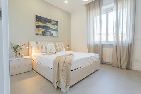 Drift off into a restful sleep in the serene bedroom