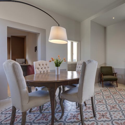 Sit down to a celebratory meal at the dining table when you're not out sampling the local trattorias