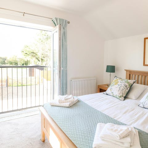 Wake up to birdsong from the primary bedroom suite