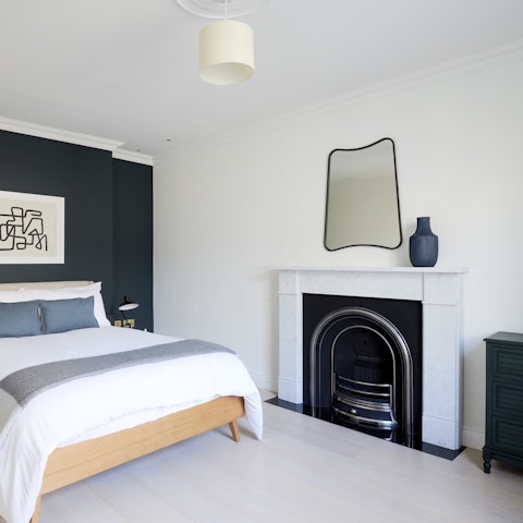 Admire the art deco-style fireplace in your bedroom