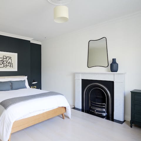 Admire the art deco-style fireplace in your bedroom
