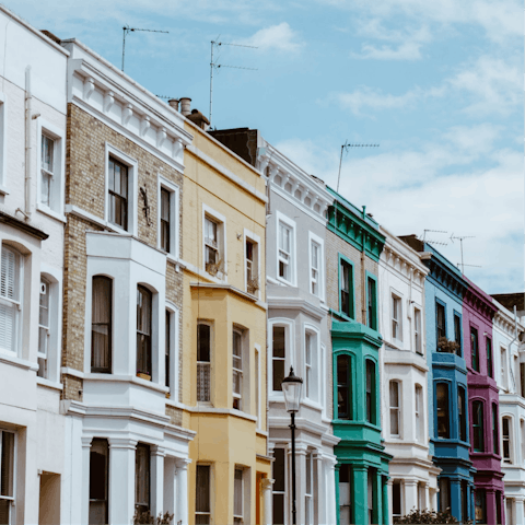Visit Portobello Road to see colourful homes and markets, fifteen minutes away
