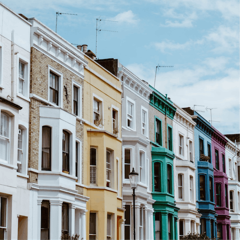 Visit Portobello Road to see colourful homes and markets, fifteen minutes away