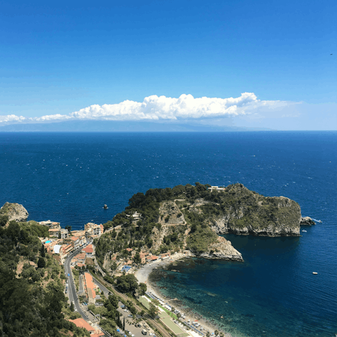 Take a scenic drive through the hills to reach picturesque Taormina, less than an hour away