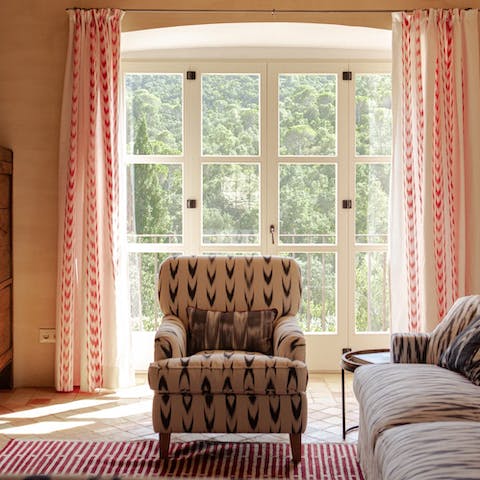 Get comfortable and enjoy a good book in the sunlit living room