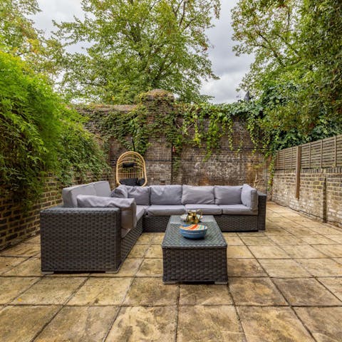 Enjoy a barbecue in the back garden on a sunny day