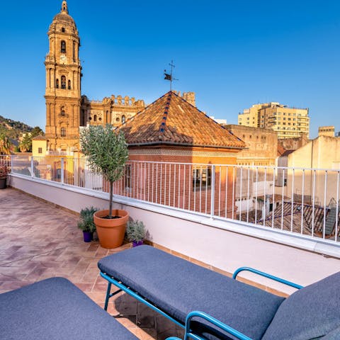 Soak up the heat from your lounger surrounded by stunning city views