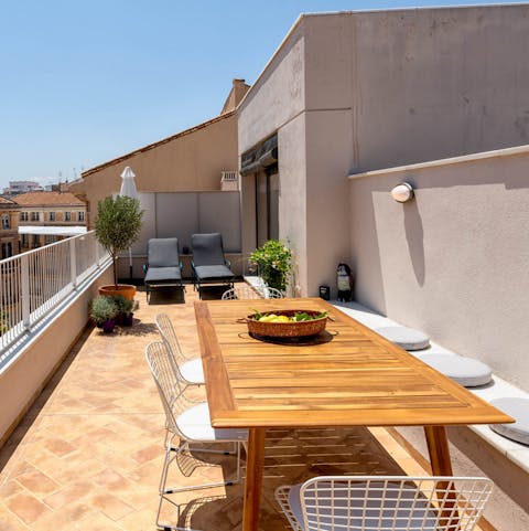 Gather at the rooftop dining table for tapas and sangria