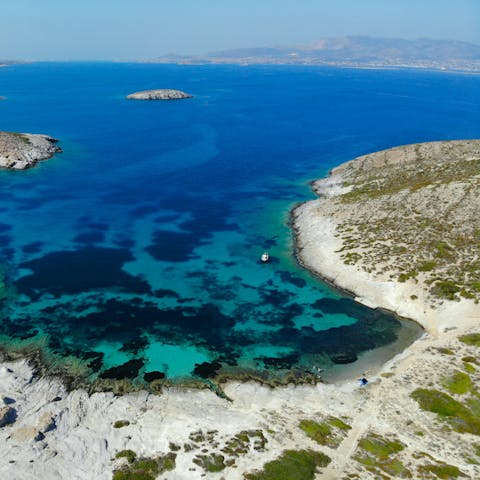 Enjoy a day trip sailing across the crystal-clear waters of Caldera