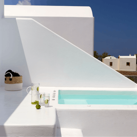 Unwind in your private outdoor heated Jacuzzi, with a cocktail in hand