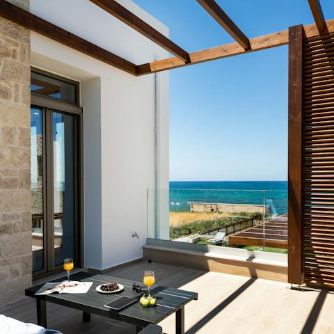 Start the day with coffee out on the balcony and admire the views of deep blue sea