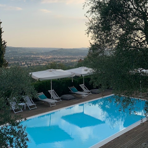 Enjoy drinks by the pool in the evening