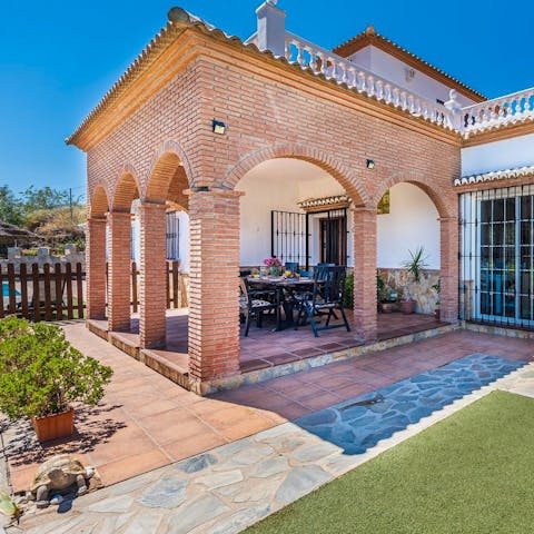 Fire up the barbecue and serve up the fruits of your labour on the covered terrace