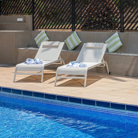 Spend carefree days stretched out by the pool