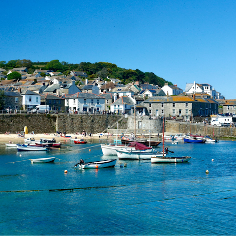 Explore the picturesque fishing village of Mousehole, a thirteen-minute drive away