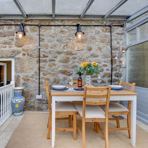 Sit down to a meal in the light-filled conservatory