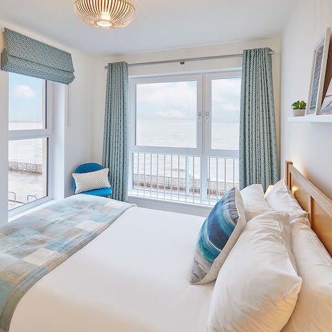 Wake up to the rolling waves of Whitley Bay right outside your bedroom window