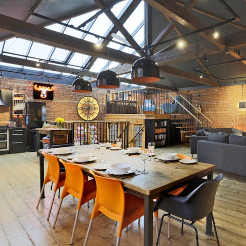 Dine in style at the wooden table in the open-concept living area