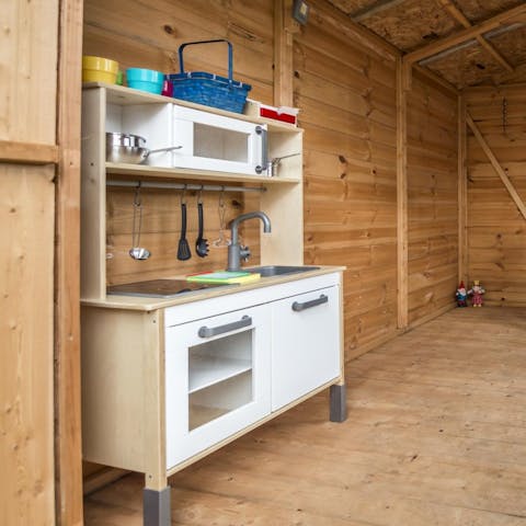 Watch the kids play pretend in the playhouse