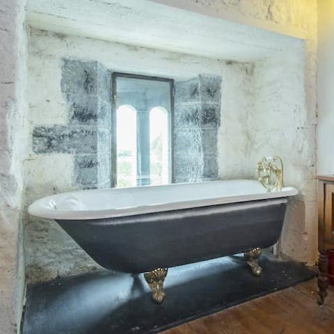 Have a soak in the clawfoot bath after a walk around the castle's meadows