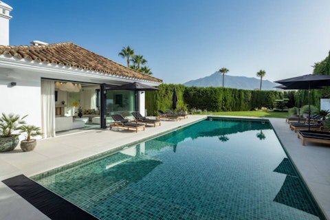 Stretch out poolside in the golden sunshine