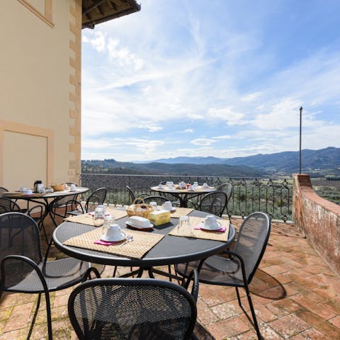 Set up for breakfast on the terrace with a view over the Tuscan hills