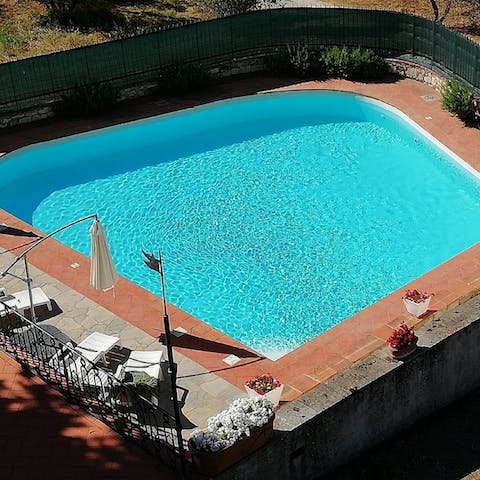 Enjoy cooling dips in the swimming pool, completely fenced in