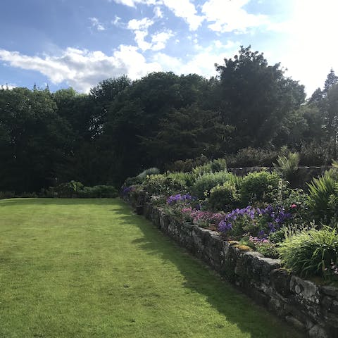 Go for a morning stroll through the six acres of private woodland and gardens