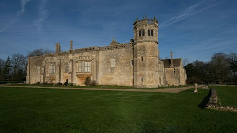 Explore Lacock Abbey's medieval cloisters and film-famous halls, a fifteen-minute drive