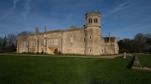 Explore Lacock Abbey's medieval cloisters and film-famous halls, a fifteen-minute drive