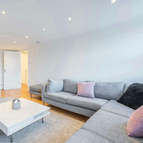 Relax together in the comfy, cosy living room after a busy day out