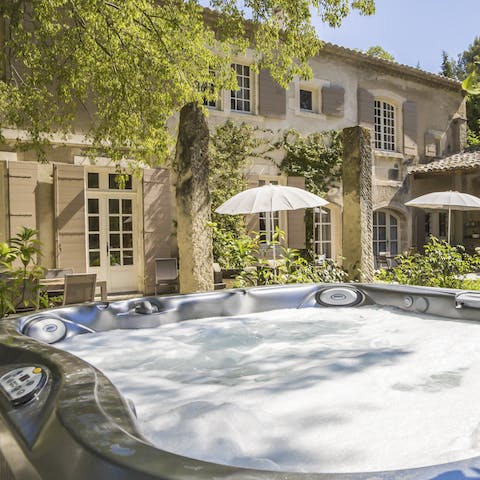 Relax in the outdoor hot tub as you sip local wine