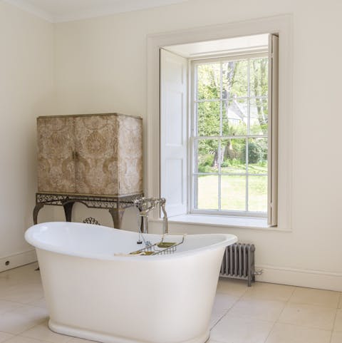 Have the most dreamy baths with green views