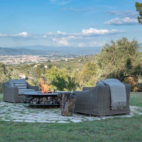 Drink in the stunning views of Florence from around the firepit