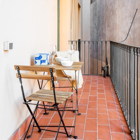 Enjoy a glass of wine on the balcony