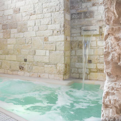 Relax in the indoor pool, complete with jets and a water feature