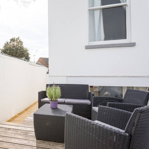 Sip drinks outdoors after going to Cheltenham Racecourse