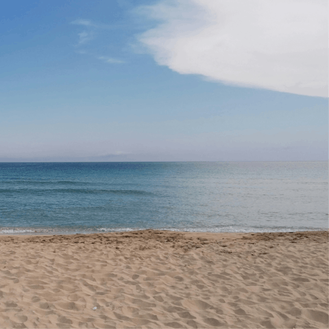 Sprawl out on Santa Maria del Focallo’s sandy beach