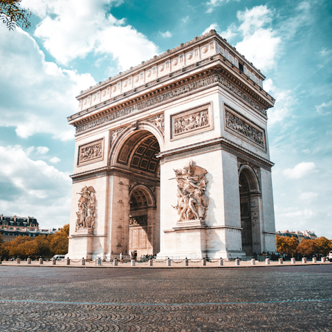 Sightsee at the Arc de Triomphe, twenty minutes away